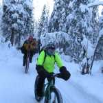 This 2011 photo provided by ArcticCycles.com shows Billy Koitzsch of Arctic Cycles guiding a group in fat-tire biking on snow in Willow, A.K. There's a new trend in mountain biking: big, puffy tires that look like something NASA developed in case someone ever wanted to ride on the moon.  (AP Photo/ArcticCycles.com, Erica Koitzsch)
