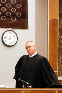Photo by Rashah McChesney/Peninsula Clarion Kenai Superior Court Judge Charles Huguelet questions defense attorneys and bailiff's about why Shane Heiman's handcuffs were not removed before jurors re-entered the room after a break on Monday April 13, 2015 in Kenai, Alaska. Heiman's defense attorneys have moved for a mistrial.