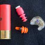 This undated photo shows shows three different types of hearing protection for hunters and shooting sports enthusiasts. At upper left is a is simple rubber ear plug with a special core to lessen loud sounds. On the right is an electronic model which is custom fitted to the ear of the wearer. On the bottom is a compact rubber ear plug with an active electronic noise canceling circuit. (AP Photo/The Spokesman-Review, Jesse Tinsley)  COEUR D'ALENE PRESS
