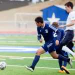 Photo by Rashah McChesney/Peninsula Clarion  Soldotna High school's Sean McMullen runs for the ball during a game against Eagle River on Friday April 24, 2015 in Soldotna, Alaska.