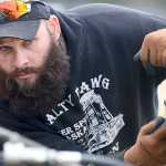 Photo by Rashah McChesney/Peninsula Clarion Emerald Ferguson, of Nikiski, listens to Larry Marsh as the two work to hook a no-till seed planter to a tractor during a Kenai Soil and Water Conservation Class on Tuesday May 5, 2015 at the rodeo grounds in Soldotna, Alaska.