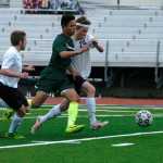 From left to right: Soldotna Boy's Varsity soccer player Austin Craig, Colony's Alex Valdez, and Soldotna's Ben Godfrey chase the ball at match on Friday, May 8 at Soldotna High School.