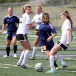 Homer sophomore Hannah Mershon weaves through trafffic during a 4-0 loss to the Knights in the Northern Lights Conference quarterfinals May 21 at Colony High School in Palmer.