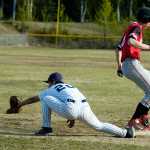 Photo by Rashah McChesney/Peninsula Clarion Soldotna Stars' Terrence Slats reaches for ball as Kenai Kardinals' Brandon Sorhus safely makes it to first base during their game on Friday May 22, 2015 in Soldotna, Alaska. Soldotna won the game 5-4.