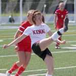 Kenai's Cori Holmes tries to volley the ball over the head of a Wasilla defender during a 2-1 overtime win over the Warriors in the Northern Lights Conference semifinals May 22 at Palmer High School.