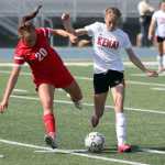 Kenai's Samantha Morse takes possesion away from Wasilla's Lydia Phillips during a 2-1 overtime win over the Warriors in the Northern Lights Conference semifinals May 22 at Palmer High School.