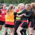 The Kenai Kardinals rush to hug goalkeeper Ali Steinbeck after the Kards edged rival Soldotna 3-2 in overtime in the Northern Lights Conference girls' title game at Palmer High School May 23.