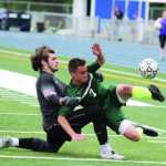 Kenai goalkeeper Wren Norwood collides with Colony forward Ben Sande after Norwood rushed out of the penalty box to try to play the ball during Colony's 4-1 win over Kenai in the Northern Lights Conference boys' title match May 23 at Palmer High School. Norwood was issued a yellow card.
