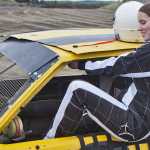 Photo by Rashah McChesney/Peninsula Clarion  Jeremy Echuk, of Kenai checks the fluid levels in Mike Eyre's car  at the Twin City Raceway during a pre-season Test & Tune day for drivers and teams who want to work the racing kinks out pre-season on Saturday May 23, 2015 in Kenai, Alaska.