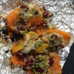 ADVANCE FOR USE MONDAY, MAY 25 -  In this photo taken May 9, 2015, quinoa-stuffed bell peppers, made by Lauren Frisch and Sam Friedman, is displayed during a campsite cookoff  at the Granite Tors campground near Fairbanks, Alaska.  Everything tastes better on a camping trip, but that doesn't mean camp food can't be improved on. (Sam Friedman/The Fairbanks Daily News-Miner via AP) MANDATORY CREDIT