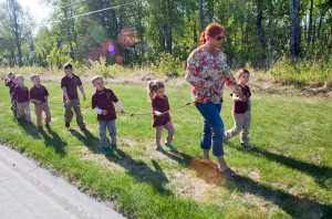 Photo by Rashah McChesney/Peninsula Clarion  A group from The Study takes a walk along Riverview Avenue on May 28, 2015 in Soldotna, Alaska.