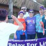 Photo by Kelly Sullivan/ Peninsula Clarion A group of survivors gets their photo taken during the 2015 Relay For Life Friday, May 29, 2015, at the Soldotna Regional Sports Complex in Soldotna, Alaska.