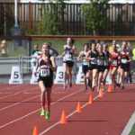 Kenai Central senior Allie Ostrander leads the field around at the conclusion of the first lap in Friday's 4A girls 3,200-meter race at the Alaska state track and field meet at Dimond Alumni Field in Anchorage.
