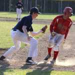 Wasilla's Jesse Thomas beats the tag of the Soldotna first baseman during Wasilla's 11-1 win over the Stars in the Southcentral Conference championship game Friday night at Houston High School.