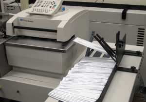 Notices warning state employees of potential layoffs if a fully funded budget is not approved by July 1 were being prepared for mailing at a state office building on Monday, June 1, 2015, in Juneau, Alaska. (AP Photo/Becky Bohrer)