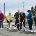 Photo by Kelly Sullivan/ Peninsula Clarion The Kenaitze Indian Tribe's Elders Committee and Executive Director Jaylene Peterson-Nyren break ground at the new Tyotkas Elder Center groundbreaking Monday, June 8, 2015, in Kenai, Alaska. The center provides services to tribal elders including meals and clinics in health and education, Peterson-Nyren said.  The new building will be 6,500 square feet, which 1,500 square feet bigger than the old center, which was demolished in April because of damages resulting from a gas leak found in the building in June, 2015, said the tribe's Communications Manager Scott Moon. Before the Kenaitze Indian Tribe purchased the building more than ten years ago, it had been used as a general store; restaurant and pharmacy, said the tribe's Executive Director Jaylene Peterson-Nyren. The new center is within walking distance from the Dena'ina Wellness Center and was designed by Kahtnuht'ana Development Corp, a new corporation whose sole shareholder is the tribe, Peterson-Nyren said.