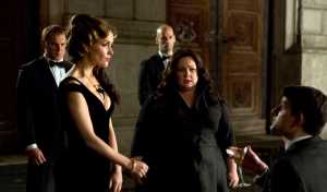 This photo provided by Twentieth Century Fox shows, Melissa McCarthy, second right, infiltrating an arms dealing ring led by Rose Byrne, left, in a scene from the film, "Spy." (Larry Horricks/Twentieth Century Fox via AP)