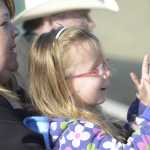 Photo by Kelly Sullivan/ Peninsula Clarion Emmie Showalter (left) and Kelsie Bliss (right) cheer on the Peninsula Oilers Thursday, June 11, 2015, at Coral Seymour Ballpark in Kenai, Alaska. The pair comes to the team's opening game every year, Showalter said.
