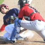 Photo by Kelly Sullivan/ Peninsula Clarion Peninsula Oiler's umpire Lukas Hermanson gets Fairbanks Goldpanner's Renae Martinez out at home base Thursday, June 11, 2015, at Coral Seymour Ballpark in Kenai, Alaska.