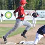 Photo by Kelly Sullivan/ Peninsula Clarion Peninsula Oiler's Ted Boeke makes it safely to first plate while Fairbanks Goldpanner's first baseman unsuccessfully tries to get him out Thursday, June 11, 2015, at Coral Seymour Ballpark in Kenai, Alaska.