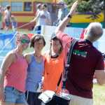 Photo by Rashah McChesney/Peninsula Clarion Anna Chesney runs across the finish line during the final leg of the Tri the Kenai triathlon on Sunday June 14, 2015 in Soldotna, Alaska.