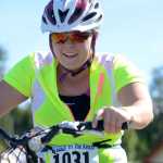 Photo by Rashah McChesney/Peninsula Clarion Katherine Tutela takes off on her bike during the Tri the Kenai race on June 14, 2015 in Soldotna, Alaska.