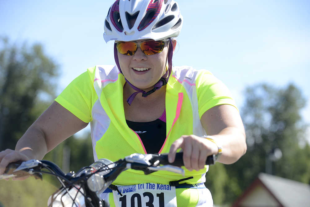 Photo by Rashah McChesney/Peninsula Clarion Katherine Tutela takes off on her bike during the Tri the Kenai race on June 14, 2015 in Soldotna, Alaska.