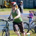 Photo by Rashah McChesney/Peninsula Clarion Ryan Peterson takes off with his bike as racing partner Chelsea Passmore cheers him on during the Tri the Kenai triathlon on June 14, 2015 in Soldotna, Alaska.