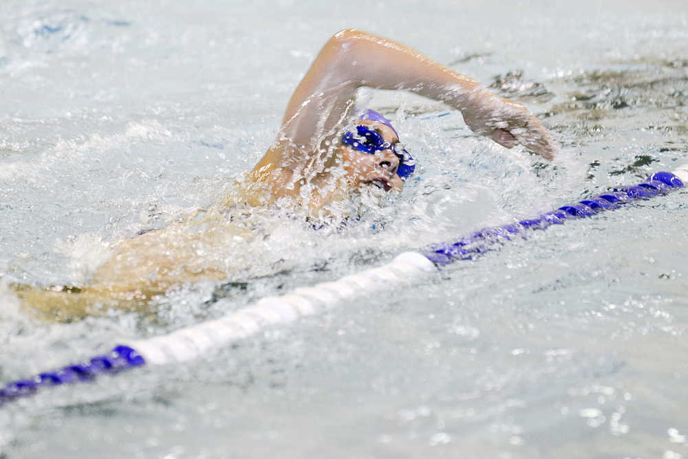 Photo by Rashah McChesney/Peninsula Clarion Katy Meek swims during the first leg of her Tri the Kenai triathlon competition day on Sunday June 14, 2015 in Soldotna, Alaska.