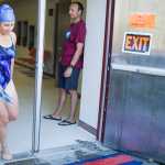 Photo by Rashah McChesney/Peninsula Clarion Katy Meek, swimmer for team "River Rush" runs out of the Skyview Middle School pool during the 2015 Tri the Kenai triathlon on Sunday June 14, 2015 in Soldotna, Alaska.