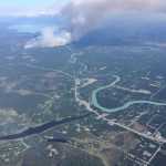 Photo by Kelly Sullivan/ Peninsula Clarion At least one home and one vehicle were consumed by the Card Street Fire on Cottontree Lane Monday, June 15, 2015, in Sterling, Alaska.