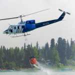 Ben Boettger/Peninsula Clarion A helicopter returns from a dumping run on the north shore of the Kenai River on Tuesday, June 16.