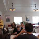 Division of Forestry Public Information Officer Terry Anderson updates residents and volunteers on the Card Street Fire at the Sterling Community Center Tuesday. Photo by Megan Pacer/Peninsula Clarion
