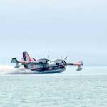 Photo by Rashah McChesney/Peninsula Clarion  A water bomber scoops water from Skilak Lake to fight the Card Street wildfire on Tuesday June 16, 2015 near Sterling, Alaska. The fire began moving northeast and authorities evacuated campgrounds on Skilak Loop Road on the Kenai National Wildlife Refuge. A portion of Skilak Loop Road has also been closed to the Lower Skilak Lake Campground, thought the boat launch remained open. The Kenai Peninsula Borough's Office of Emergency Management reports that 10 structures have been damaged in the fire, including three homes. It is estimated to have consumed about 1800 acres.