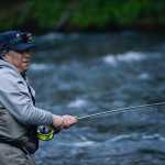 Photo by Rashah McChesney/Peninsula Clarion John Mun, of Anchorage, reels a fish in during the Russian River sockeye salmon opener on Thursday June 11, 2015 near Cooper Landing, Alaska.