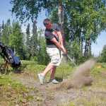 Photo by Rashah McChesney/Peninsula Clarion Brock Cant hits away from a group of trees during the Junior's Golf Tournament on June 18, 2015 at the Birch Ridge Golf Course in Soldotna, Alaska.
