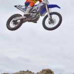 Photo by Rashah McChesney/Peninsula Clarion  Jesse Kelly flies through the air during a race at a state motocross compeition on Saturday June 20, 2015 at Twin City Raceway in Kenai, Alaska.