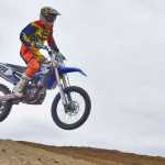 Photo by Rashah McChesney/Peninsula Clarion  Jesse Kelly flies through the air during a race at a state motocross compeition on Saturday June 20, 2015 at Twin City Raceway in Kenai, Alaska.