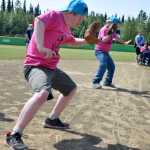 Photo by Rashah McChesney/Peninsula Clarion Infielders dance while waiting for a player to bat during the annual World Series of Baseball event put on for community members with special needs on Friday June 19, 2015 in Soldotna, Alaska.