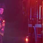 Photo by Rashah McChesney/Peninsula Clarion  Central Emergency Services firefighter Reed Quinton directs a fire truck to move during a late-night call on a high speed chase that ended on Funny River Road on Wednesday June 25, 2015 in Soldotna, Alaska.