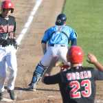 Photo by Kelly Sullivan/ Peninsula Clarion Kenai Peninsula Oilers' Adam Moreau cheers Jimmy Galusky through home base during a double play in the game against the Seattle Studs, Thursday, June 25, 2015, at Coral Seymour Park in Kenai, Alaska.