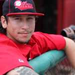 Photo by Kelly Sullivan/ Peninsula Clarion Kenai Peninsula Oilers player David Diaz stands in the dugout Thursday, June 25, 2015, at Coral Seymour Park in Kenai, Alaska.