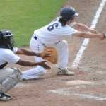 Photo by Kelly Sullivan/ Peninsula Clarion Kenai Post 20 Twins taps the ball before running to first Saturday, June 27, 2015, at Coral Seymour Park in Kenai, Alaska.