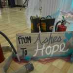Photo by Megan Pacer/ Peninsula Clarion  Bob and Hope Hensler marry in front of friends, family, community members and firefighters during a Sunday afternoon ceremony at the Sterling Community Center.