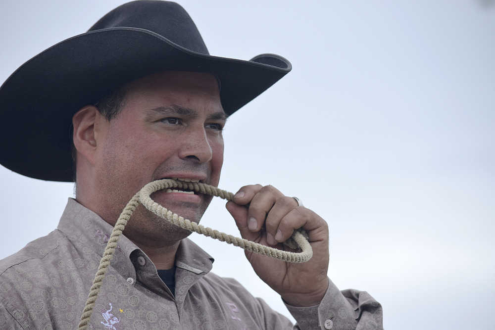 Photo by Rashah McChesney/Peninsula Clarion  Steven Primera readies his horse before the double mugging - a form of calf tying -  competition on Sunday July 5, 2015 at the Ninilchik Rodeo in Ninilchik, Alaska.