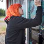 David Proveaux, of Homer, (right) samples a cannabis product with the help of another member of the Green Rush Events Clubhouse on Saturday in Kenai. Photo by Megan Pacer/Peninsula Clarion