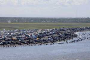Rashah McChesney/Peninsula Clarion  In this July 20, 2013 file photo, several thousand dipnetters converge on the mouth of the Kenai River to catch a share of the late run of sockeye salmon headed into the river  in Kenai. The city of Kenai is preparing to handle the influx of people for the fishery, which opens Friday.
