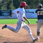 Ben Boettger/Peninsula Clarion  zips along the basline to first  during a game against the Kenai Peninsula Oilers on Thursday, July 23.