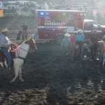 Photo by Megan Pacer/Peninsula Clarion Luke Moore, of Wasilla, smiles at the announcers moments after riding the night's most anticipated bull, Holy Cow, Friday night during the Progress Days Rodeo at the Soldotna Rodeo Grounds.