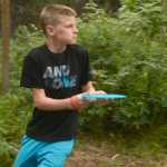 Ben Boettger/Peninsula Clarion Lance Chilton, the youngest competitor in a disc golf tournament at Tsalteshi Trails, concentrates before taking a shot on Saturday, July 25.